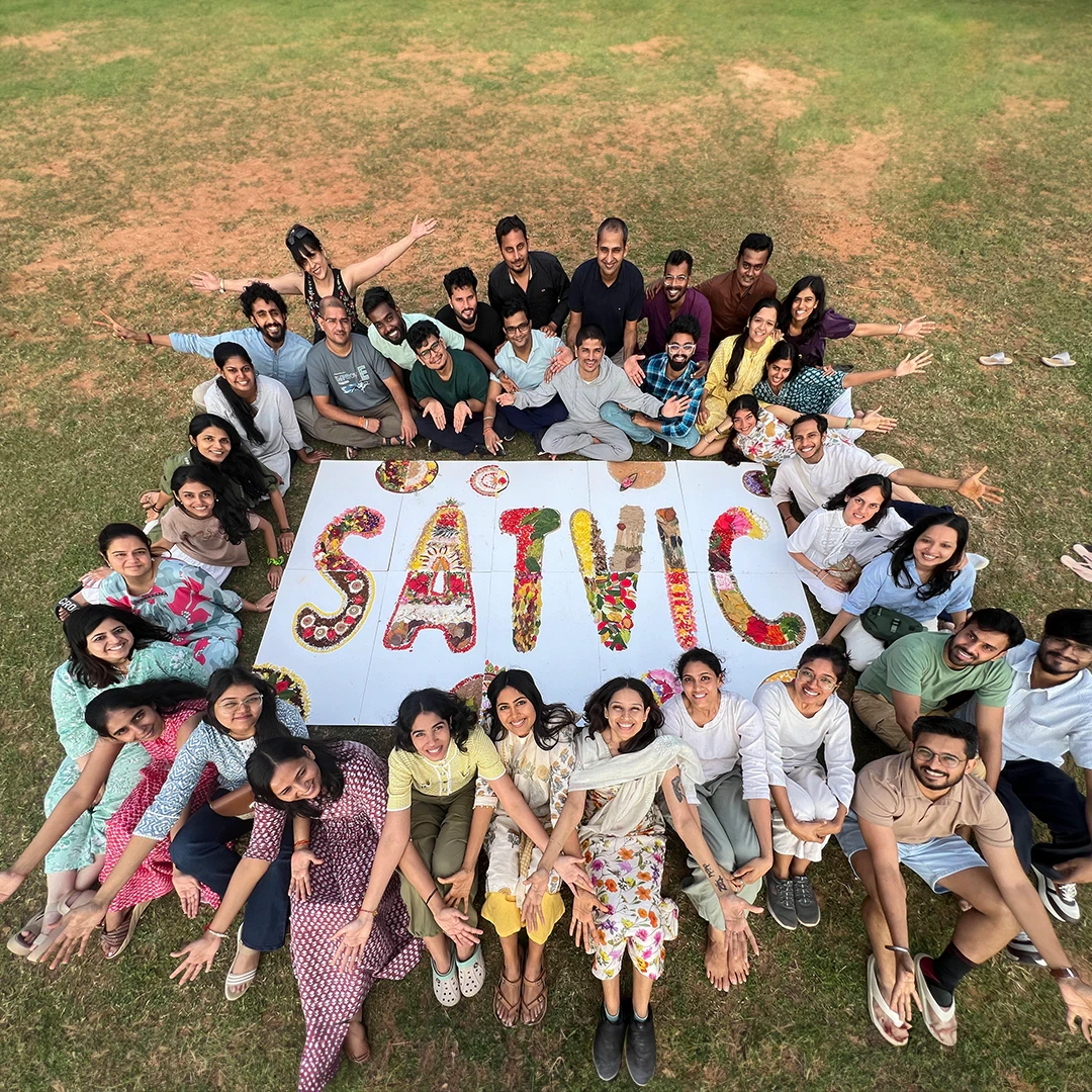 The Satvic Movement education team gathered outdoors